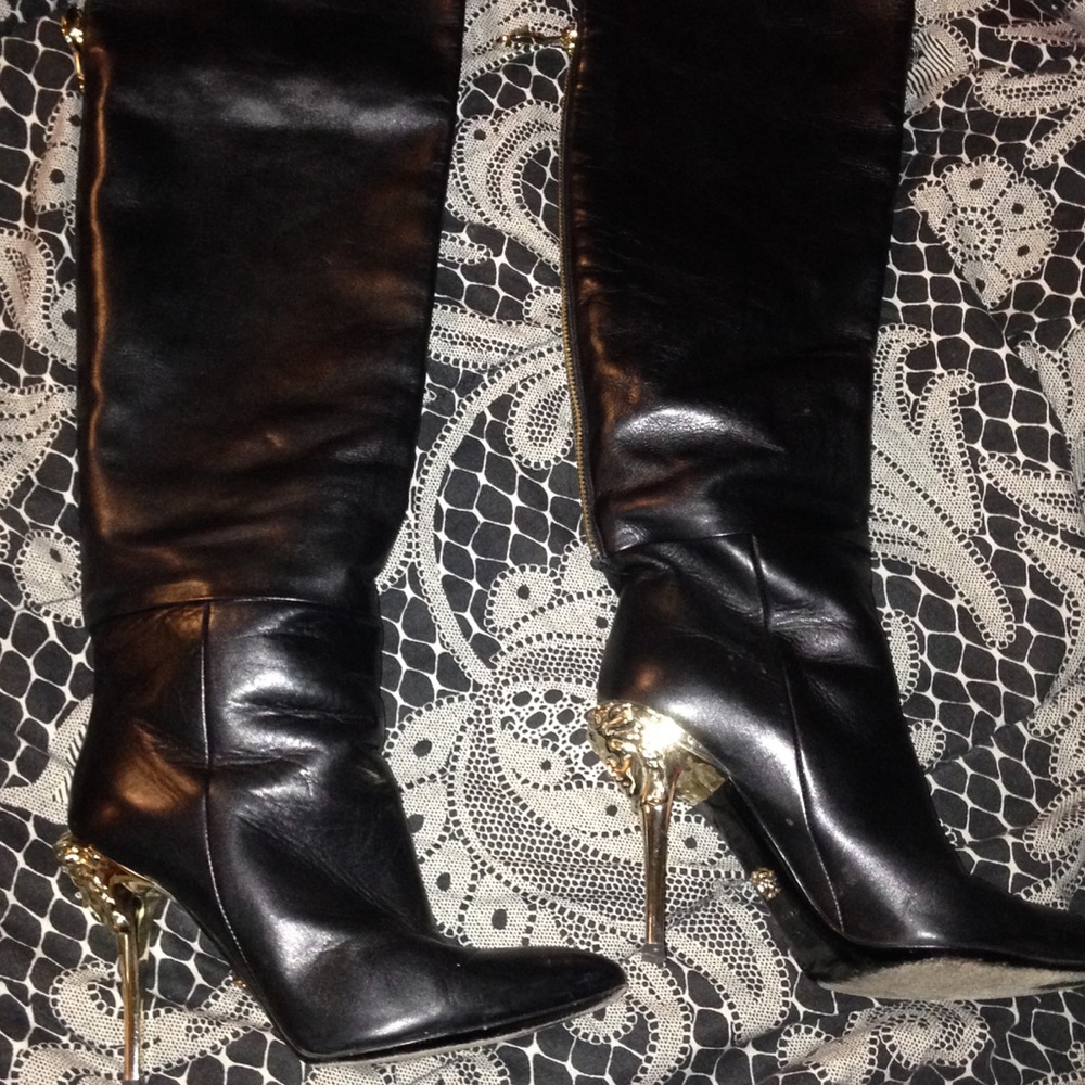 Versace boots with face on heels
